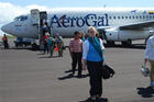 SIS Galapagos Summer Program students disembark from an airliner.